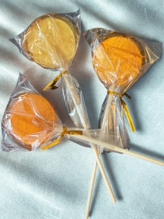 Hard honey lollipops on a stick wrapped individually in plastic.